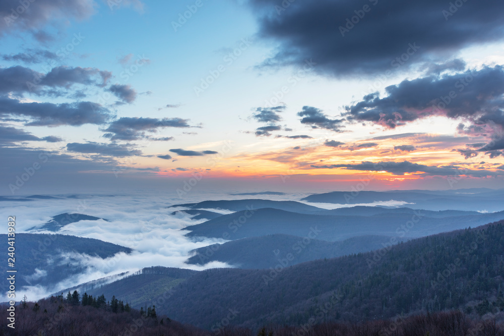 Beautiful sunrise in the Skole Beskydy with fantastic beauty over the sky, and the fog sea around the majestic Carpathian Mountains. Beautiful sunrise in the Skole Beskydy with fantastic beauty over the sky, and the fog sea around the majestic Carpathian Mountains.