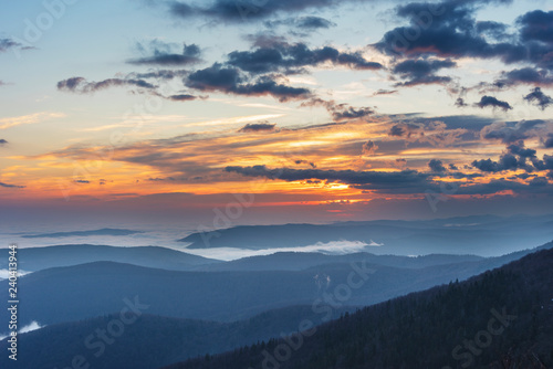 Beautiful sunrise in the Skole Beskydy with fantastic beauty over the sky  and the fog sea around the majestic Carpathian Mountains.