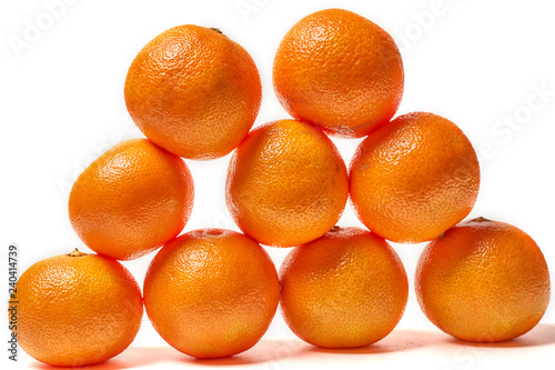 Lots of ripe mandarins isolated on white background