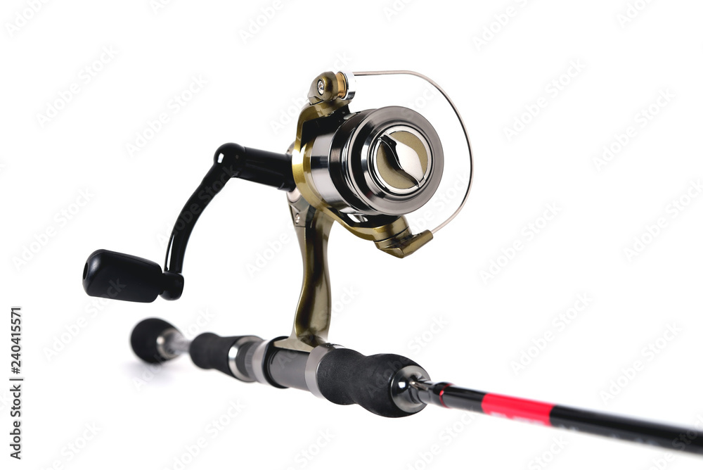 Obraz premium fishing reel on a fishing rod, white background close-up, copy space