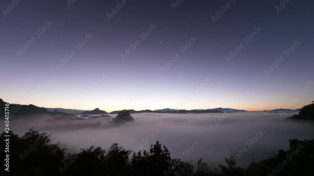 sunrise and sea of fog timelapse.clear sky and beautiful morning landscape.Dramatic vibrant color of sky light.Beginning to start work successful concept. sunrise and sea of fog timelapse.clear sky and beautiful morning landscape.Dramatic vibrant color of sky light.Beginning to start work successful concept.
