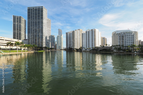 Miami  Florida 09-08-2018 Buildings of the City of Miami and Brickell Key and their reflections on the tranquil water of Biscayne Bay.