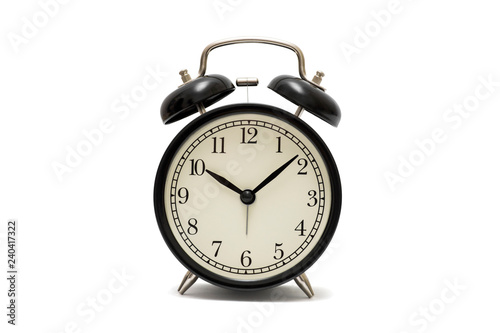 Classic black table clock isolated on a white background. Black retro alarm clock isolated on white background