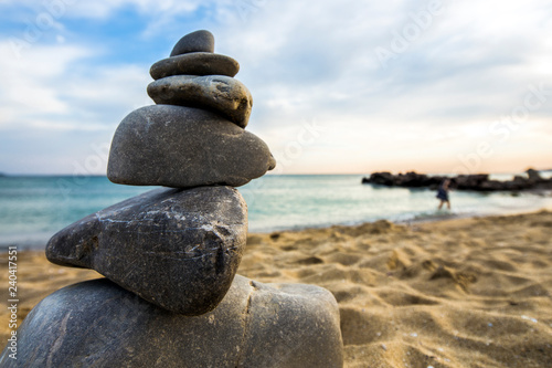 Stone cairn at the beach  concept of balance