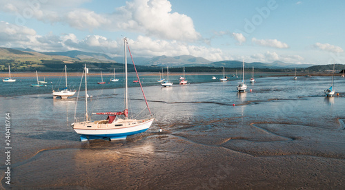 Yachts at low tide in the Menai Strait (Anglesey island, Wales, Great Britain)