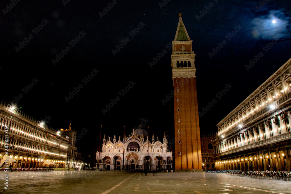 Night view of Piazza San Marco, Venice, Italy. View on the bell tower, the basilica, the old and new Napoleonic Procuratie.