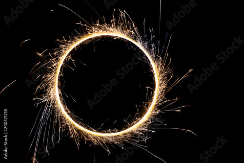 Canvas Print beautiful sparkler in a circle on a black background