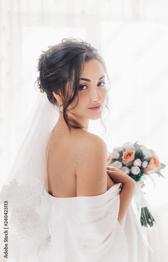 Beautiful brunette bride with stylish make-up in white dress Beautiful brunette bride with stylish make-up in white dress