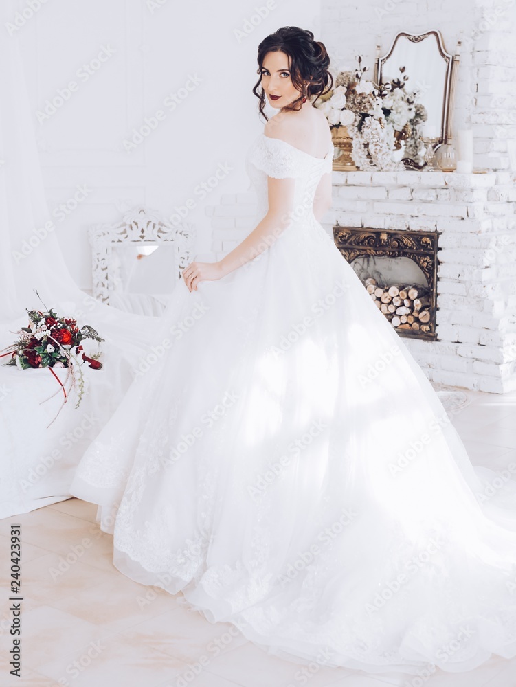 Beautiful brunette bride with stylish make-up in white dress Beautiful brunette bride with stylish make-up in white dress