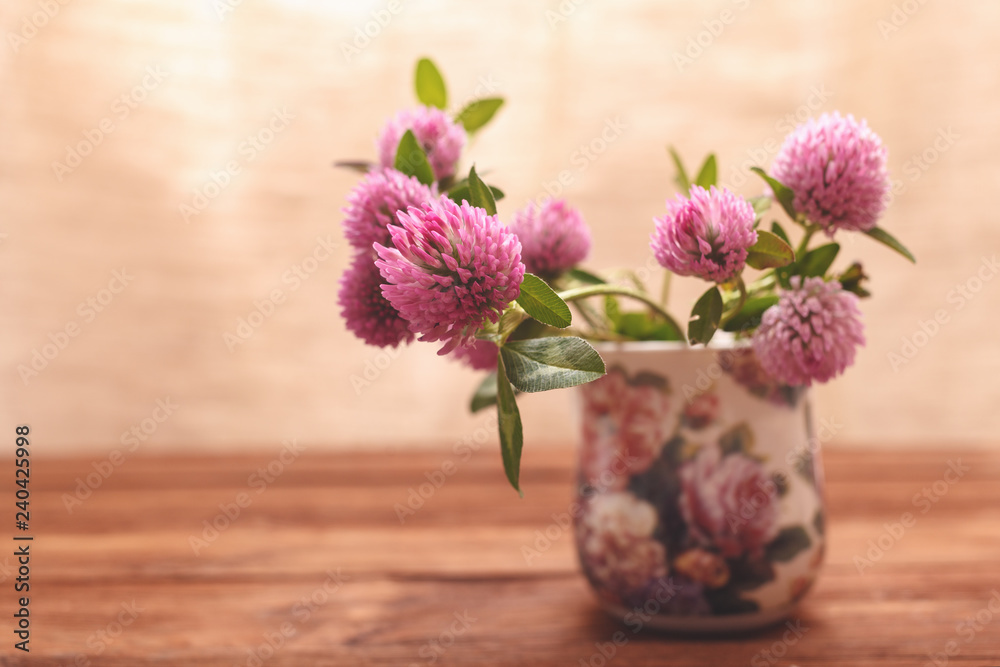 custom made wallpaper toronto digitalClover flowers on wooden background. Beautiful purple wild flower. Medicinal herb. Close-up of red clover flowers in the lighting Studio