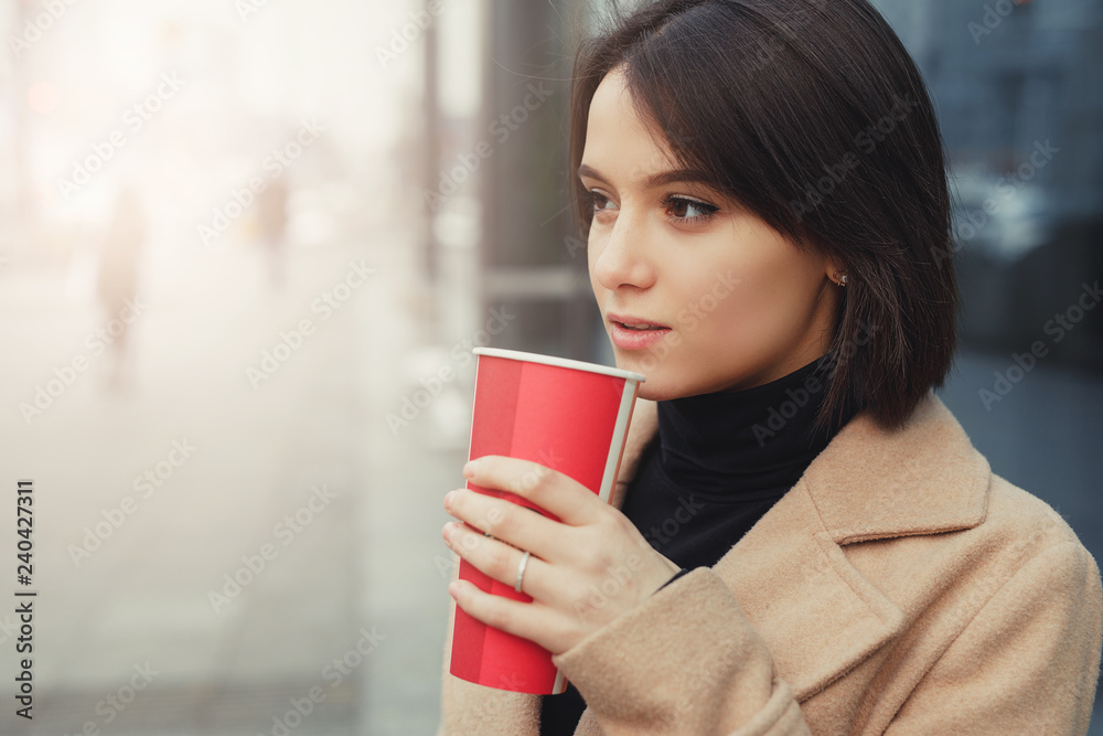 Woman Drink Her Hot Coffee While Walking On The Street. Portrait Of Stylish Smiling Woman In Winter Clothes Drinking Hot Coffee. Female Winter Style. - Image Woman Drink Her Hot Coffee While Walking On The Street. Portrait Of Stylish Smiling Woman In Winter Clothes Drinking Hot Coffee. Female Winter Style. - Image