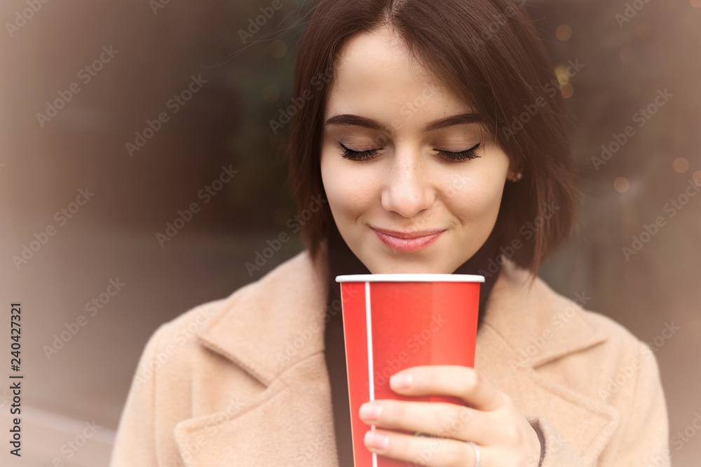 Woman Drink Her Hot Coffee While Walking On The Street. Portrait Of Stylish Smiling Woman In Winter Clothes Drinking Hot Coffee. Female Winter Style. - Image Woman Drink Her Hot Coffee While Walking On The Street. Portrait Of Stylish Smiling Woman In Winter Clothes Drinking Hot Coffee. Female Winter Style. - Image