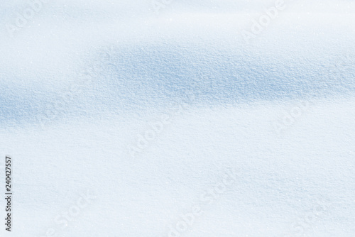 Fresh snow background texture. Winter background with snowflakes and snow mounds. Snow lumps. © Сyrustr
