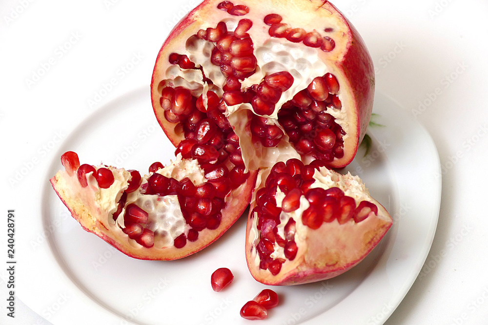 pomegranate grains in plate, very red pomegranate grains, looking great on white background pomegranate grains in plate, very red pomegranate grains, looking great on white background