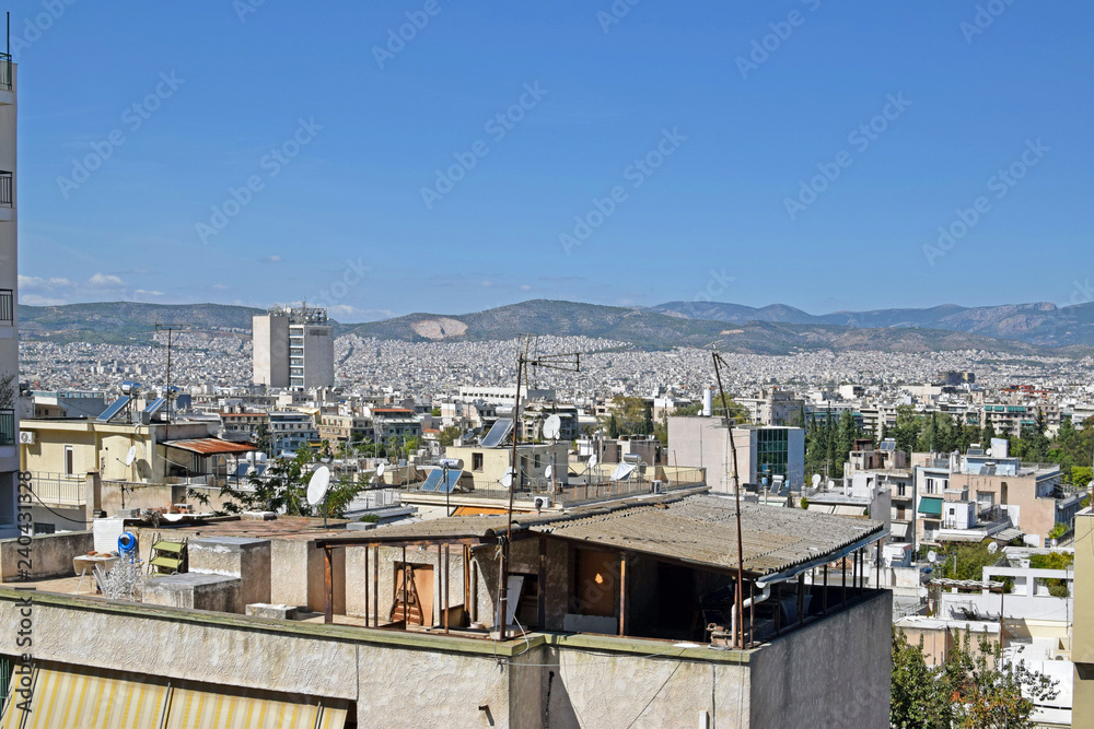 View of the city of Athens and the roofs of residential buildings. The rise in the center of Athens from which you can see the panorama of the city in the summer. Residential areas of the center