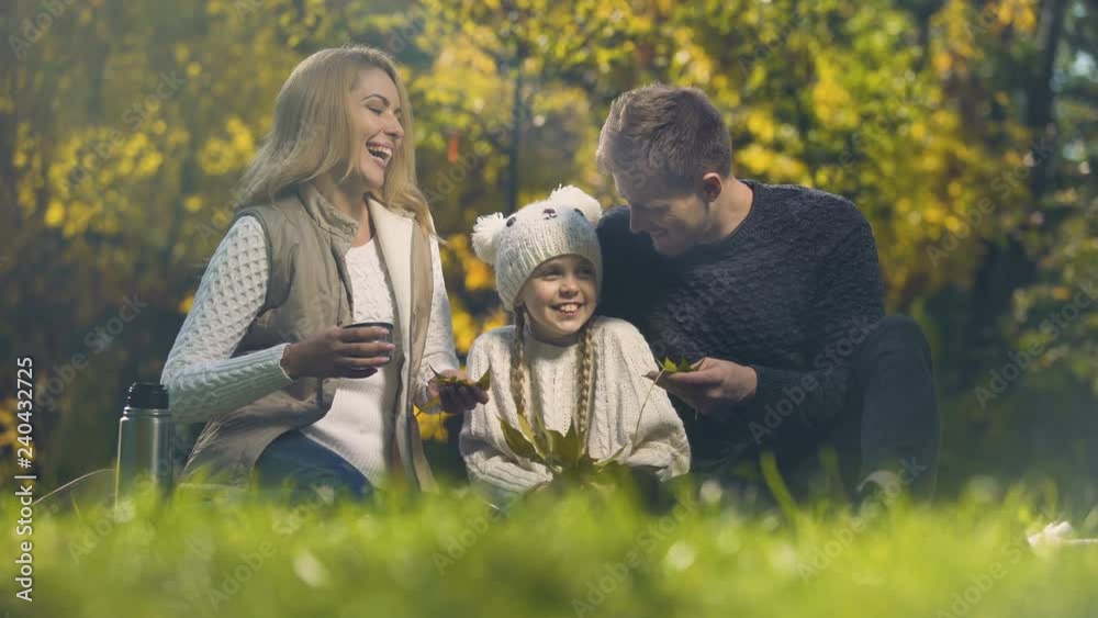 Joyful family having fun in autumn park, spending leisure time together, happy Joyful family having fun in autumn park, spending leisure time together, happy
