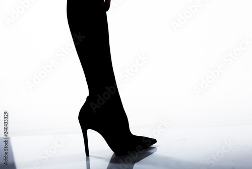 Woman legs and black heels