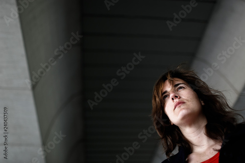 Portrait of pensive woman seen from below. © Joaquin Corbalan