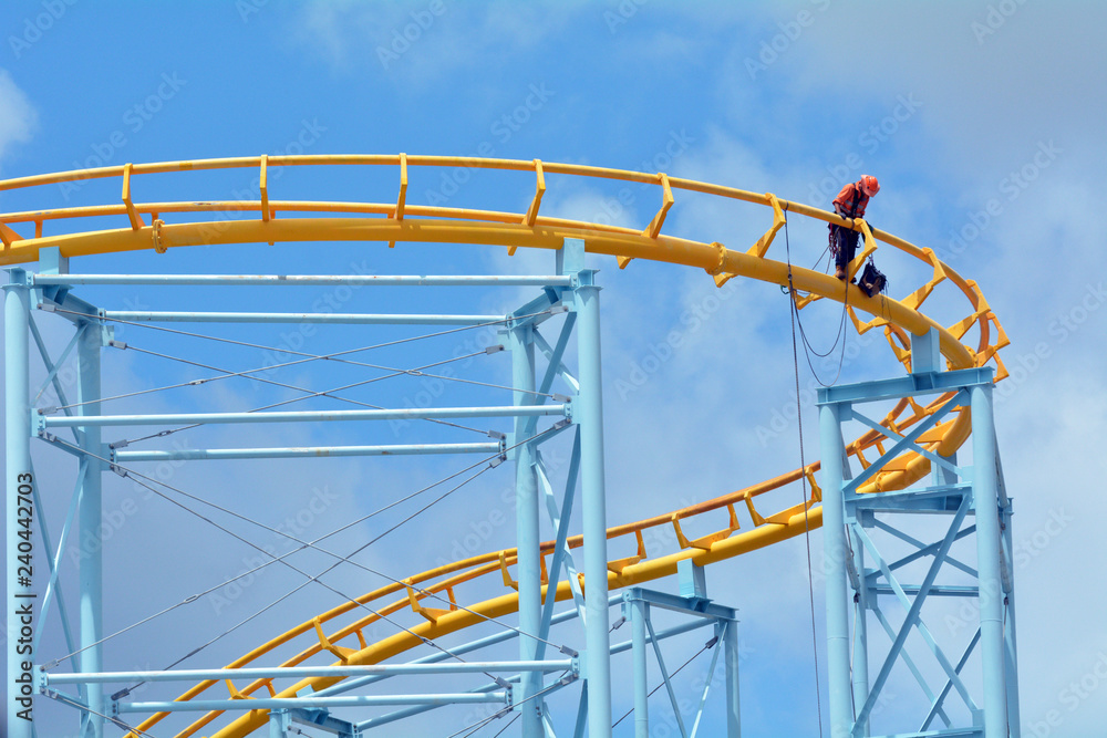 Construction Engineer Checks Connections on a Roller Coaster