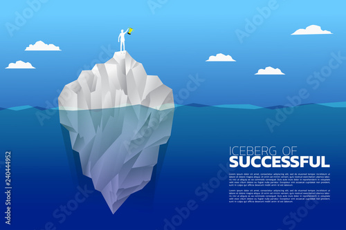 silhouette of businessman with champion trophy on top of iceberg. Concept of growth business, Success in Career path.