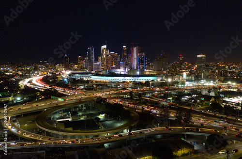 Urban aerial view of the downtown Los Angeles convention center, city skyline and freeway traffic at night © Newport Coast Media