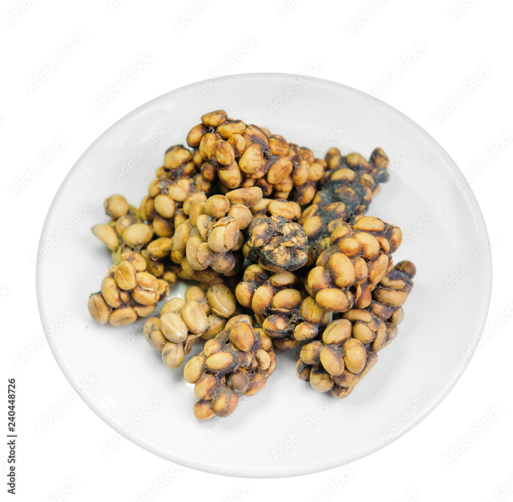 Weasel coffee beans on dish Weasel coffee beans on dish