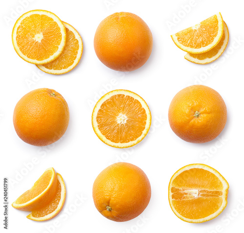 A set of whole and sliced oranges, cut out. Top view.