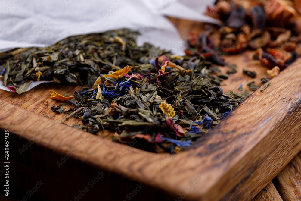 Tea in a specialized package for brewing on a wooden background. Variety varieties.