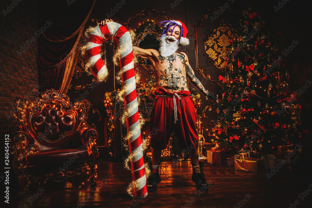 Fototapeta premium big man with big christmas candy