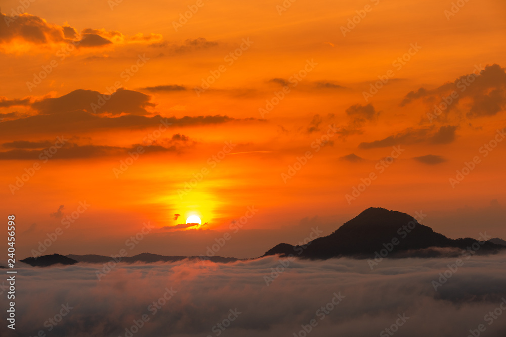 Beautiful dramatic sunset in the mountains. Landscape lot of fog Phu Thok Mountain at Chiang Khan ,Loei Province in Thailand. Beautiful dramatic sunset in the mountains. Landscape lot of fog Phu Thok Mountain at Chiang Khan ,Loei Province in Thailand.