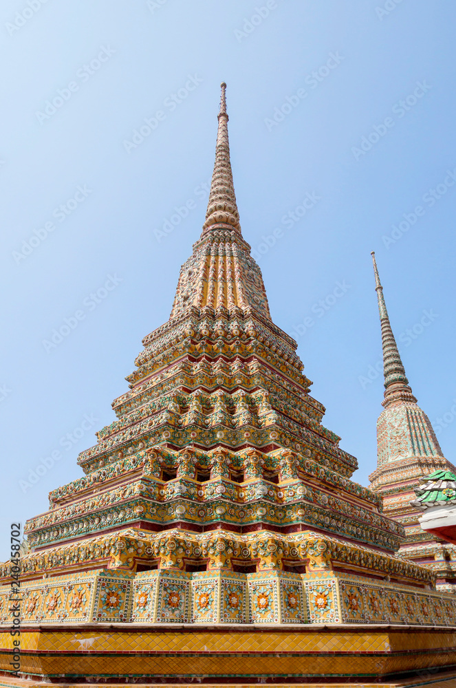 Bangkok, Thailand Wat Pho Temple Of The Reclining Buddha. The Great Pagodas of the Four Kings. This is a group of 4 huge pagodas (stupas) in honor of the first 4 monarchs of the Chakri dynasty. 