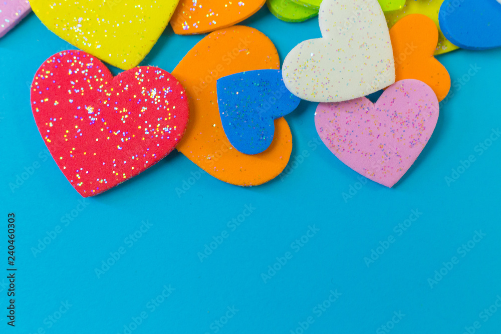 Obraz premium multi colour heart on blue background close up image.