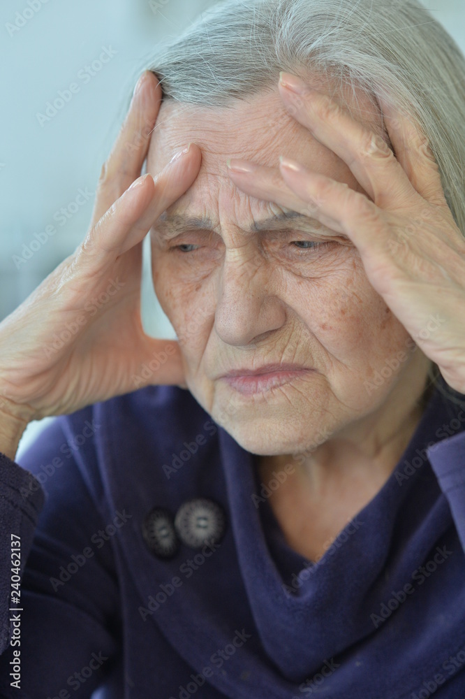 Portrait of sad elderly woman with hands on head Portrait of sad elderly woman with hands on head