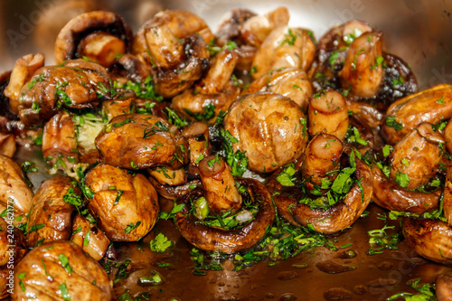 Grilled champignons mushrooms with parsley © olyasolodenko