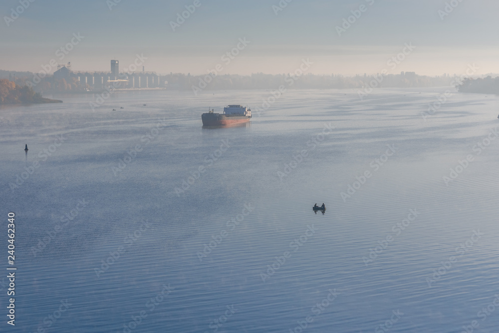 Cargo ship in fog on a river Dnieper Cargo ship in fog on a river Dnieper