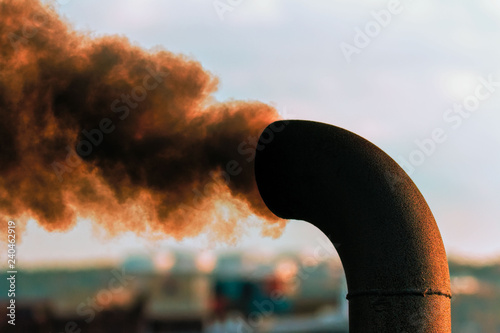 smokestack spewing out black smoke