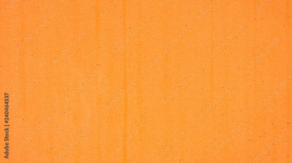Fototapeta premium Close up of an orange sponge for a background.