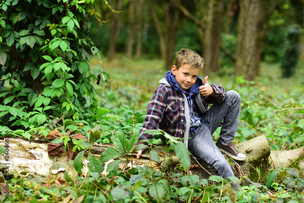 My approval, my thumb up. Little child give thumb up in woods. Little child show satisfaction. Everyone wants approval My approval, my thumb up. Little child give thumb up in woods. Little child show satisfaction. Everyone wants approval