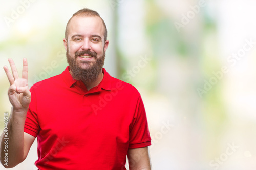 Young caucasian hipster man wearing red shirt over isolated background showing and pointing up with fingers number three while smiling confident and happy.