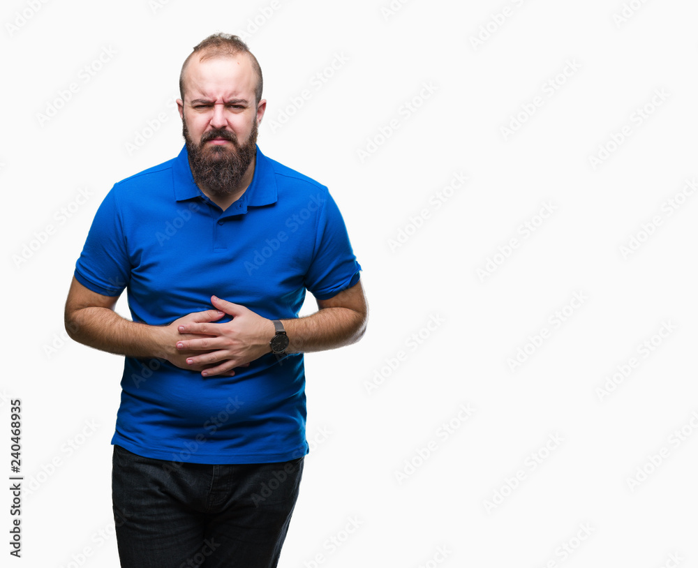Young caucasian hipster man wearing blue shirt over isolated background with hand on stomach because indigestion, painful illness feeling unwell. Ache concept. Young caucasian hipster man wearing blue shirt over isolated background with hand on stomach because indigestion, painful illness feeling unwell. Ache concept.