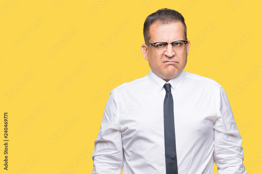 Middle age bussines arab man wearing glasses over isolated background skeptic and nervous, frowning upset because of problem. Negative person. Middle age bussines arab man wearing glasses over isolated background skeptic and nervous, frowning upset because of problem. Negative person.