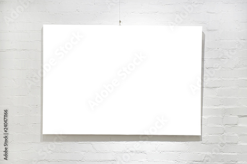 Empty frame on white brick ...