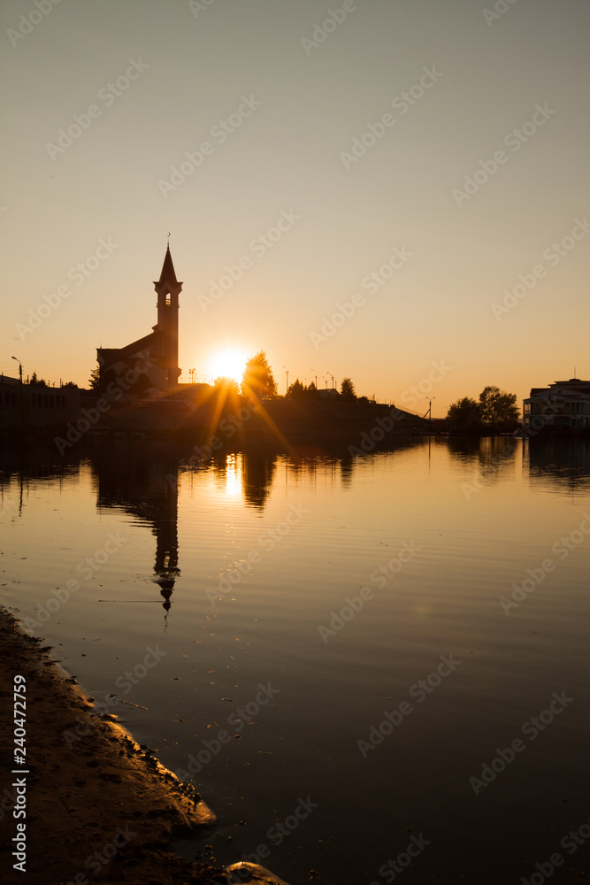 Fototapeta premium Mosque against the backdrop of beautiful sunset sky