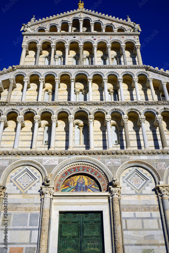 Exterior view of the Pisa Cathedral facade (Santa Maria Assunta) on the Square of Miracles (Piazza dei Miracoli) complex near the Leaning Tower of Pisa in Tuscany, Central Italy