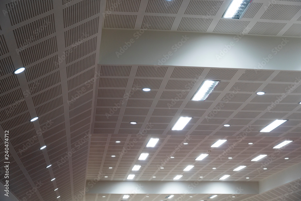 Many ceiling lights in the auditorium.