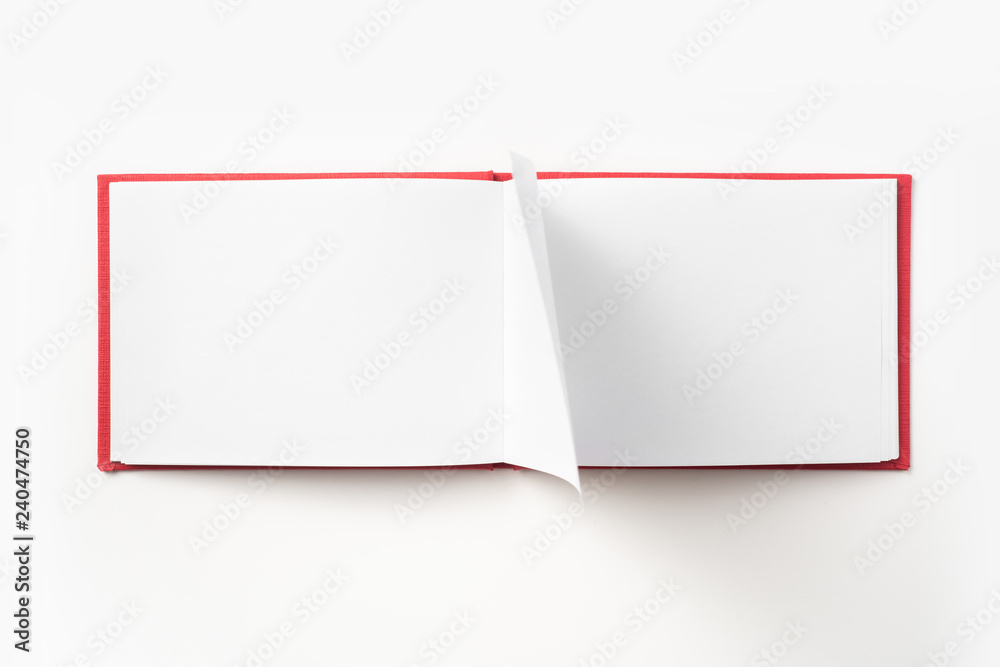 Top view of red notebook with open page Top view of red notebook with open page