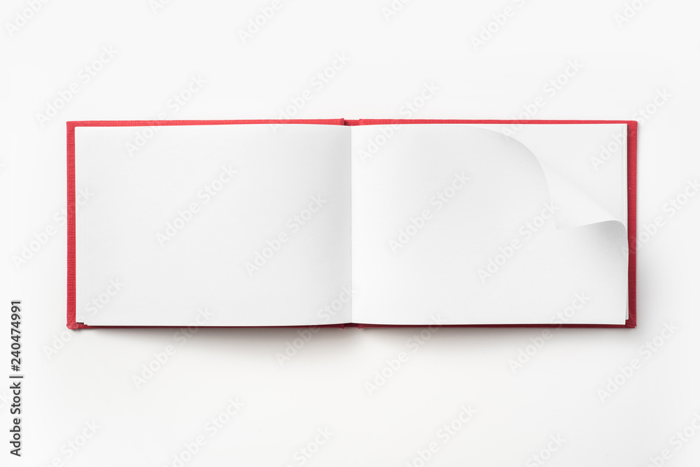 Top view of red notebook with open page Top view of red notebook with open page