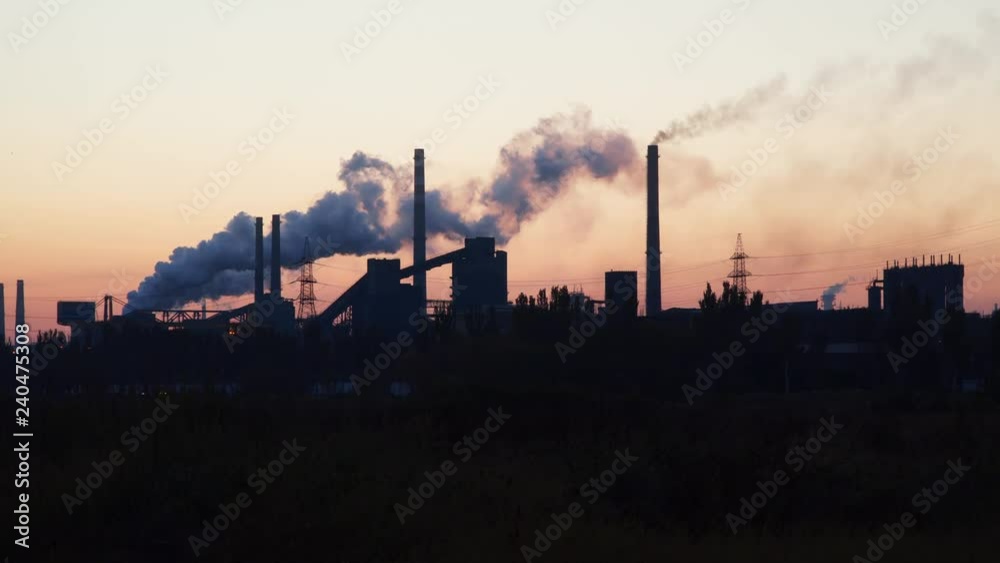 Industrial enterprise at dawn. Environmental pollution Industrial enterprise at dawn. Environmental pollution