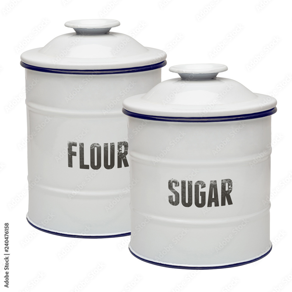 White enamel canisters in flour and sugar isolated on white background White enamel canisters in flour and sugar isolated on white background