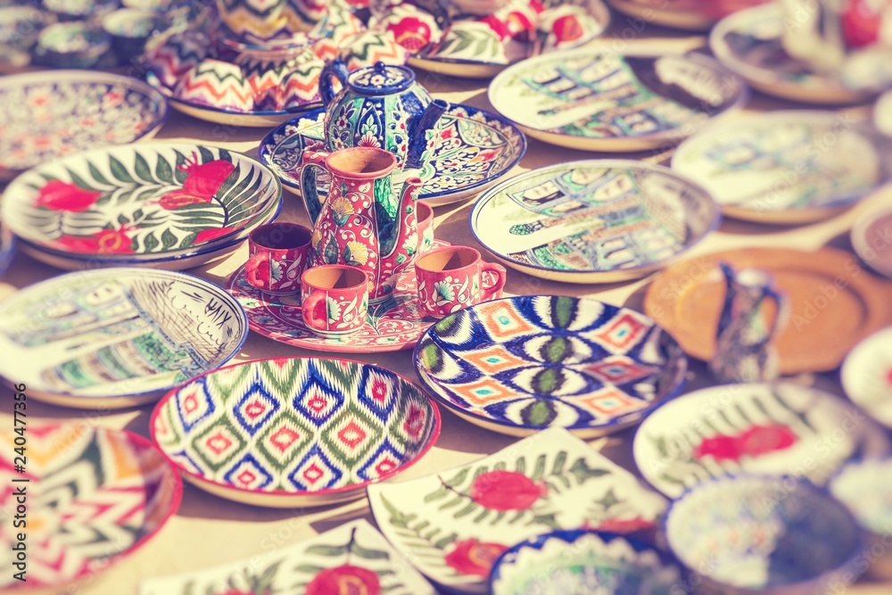 Plates and pots on a street market in Uzbekistan. Selective Focus.